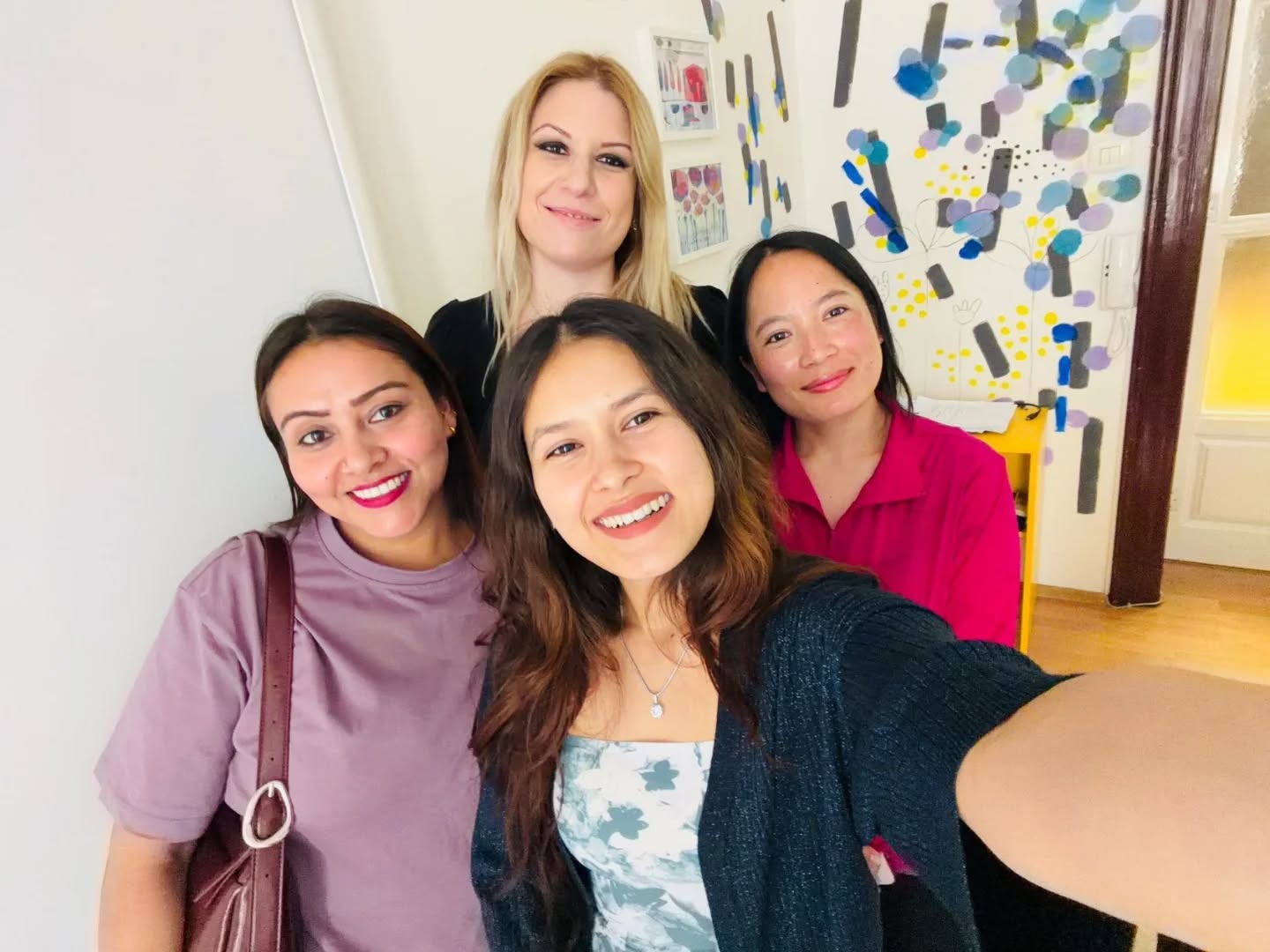 Adult learners and their teacher at OMNIA